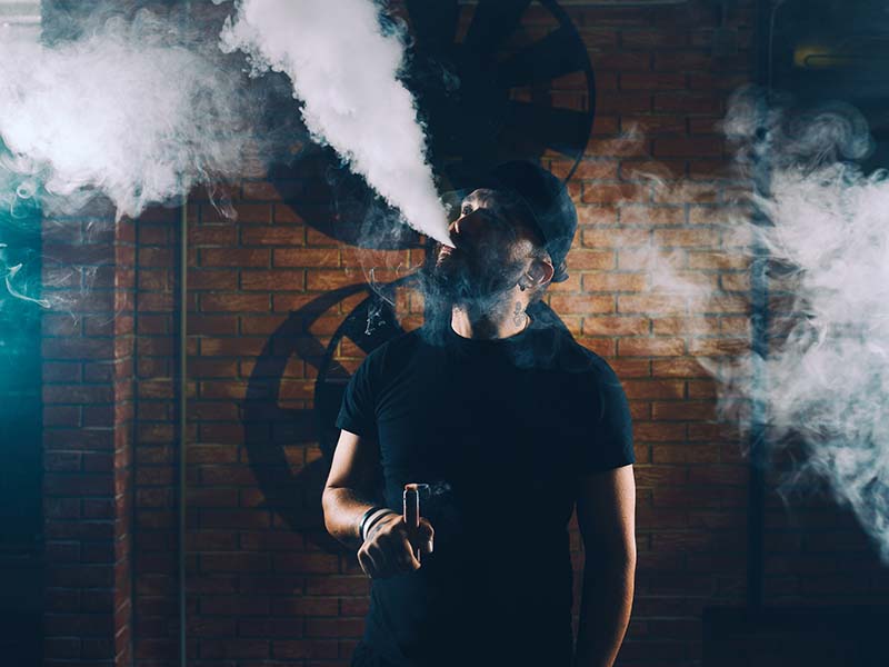Man vaping an electronic cigarette